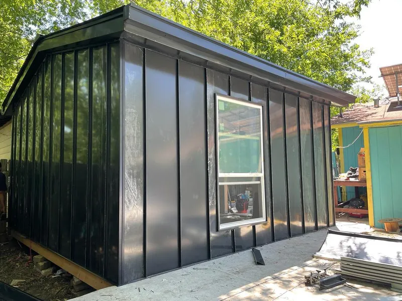 Black standing seam metal wall panels for Roof Inspection in College Park